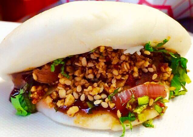 Chinatown Bao:

Crispy-fried duck, honey teriyaki, rice vinegar-soaked radish, pepper caramel, crushed peanuts, red pepper, and mint sauce!