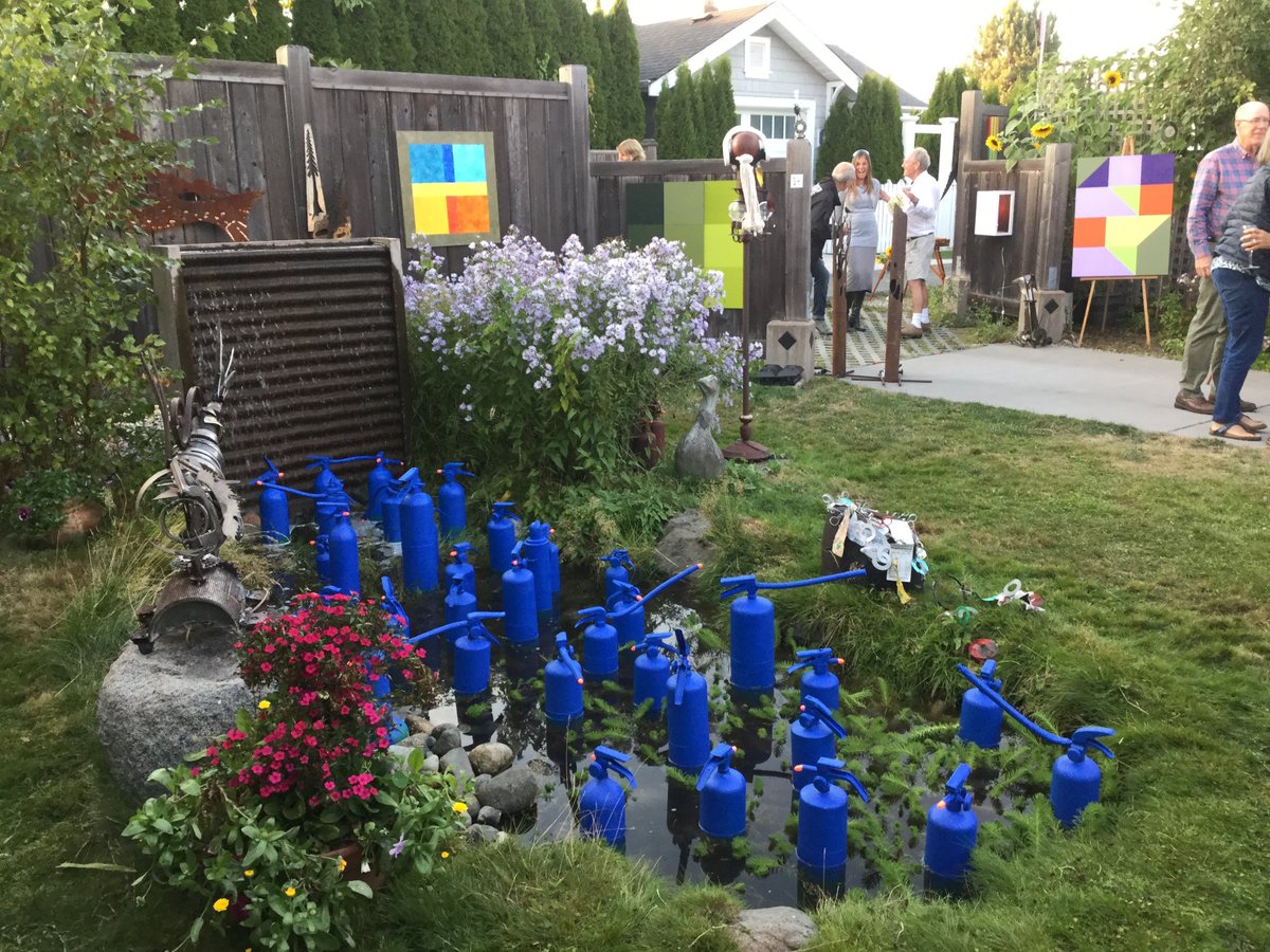 LyndaMcKewan's tweet photo. #Installation #Fireextinguishers in #Pond Richard Pawley #OakBay Art in the Lane Sept. 16th. #repurposed, #founditems. #Complementray Colour https://t.co/1vJZ5po3dW