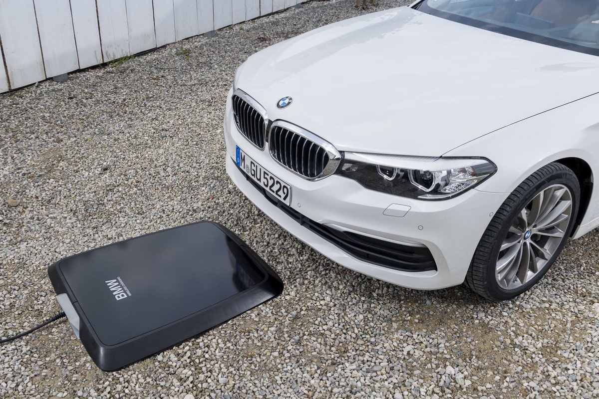 verge's tweet photo. BMW is set to offer a pad to wirelessly charge your car https://t.co/QhA8hy4A1r https://t.co/Lo9pUVSxpr