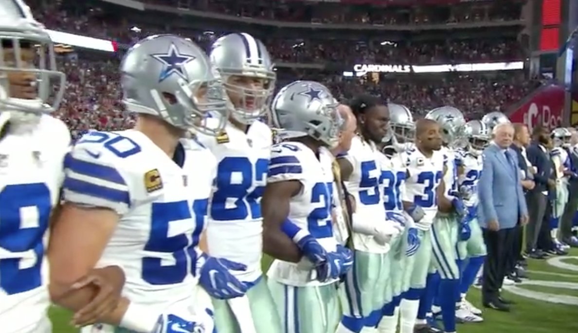 FOX4's tweet photo. #DallasCowboys and Jerry Jones briefly kneel before national anthem and then stand arm-in-arm. https://t.co/fbNa6sREUj https://t.co/Xb9eyxrNAG