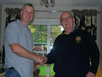 Lion John Williams presented a cheque for £1,000 to Anthony Morgan of #HarropRoad Residents Grp for redevelopment of the site in #Bollington