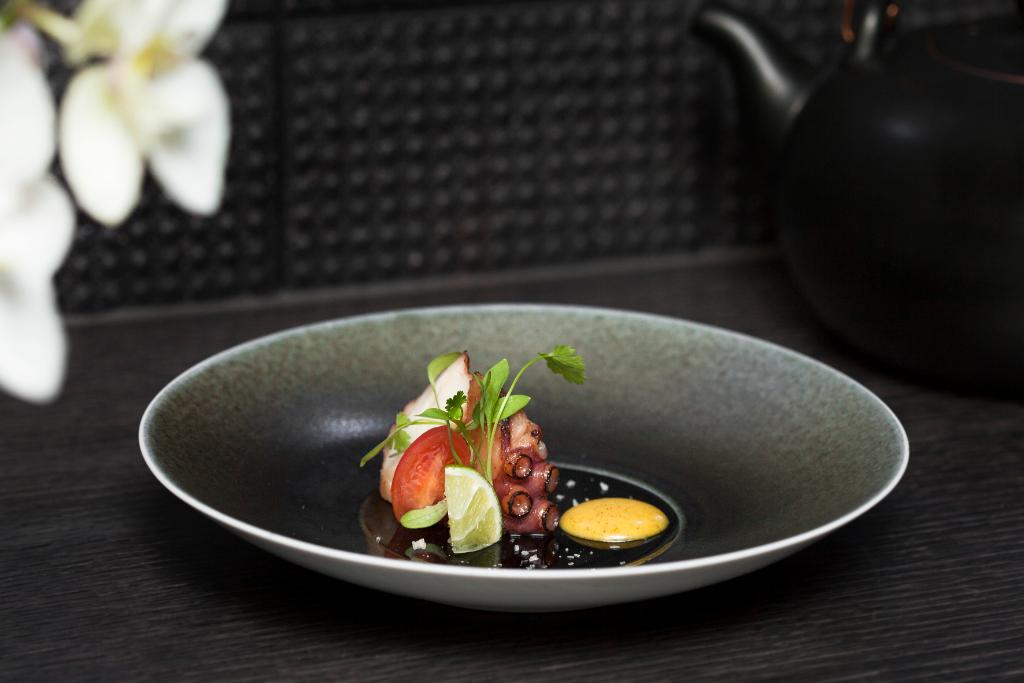 Chargrilled octopus with cherry tomato, smoked sea salt and cinnamon sauce: a dish from our #solarterms tasting menu spr.ly/60178NjfJ