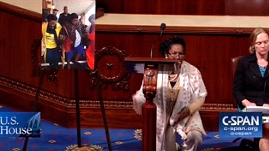 Sheila Jackson Lee (Democrat) takes a knee on House floor