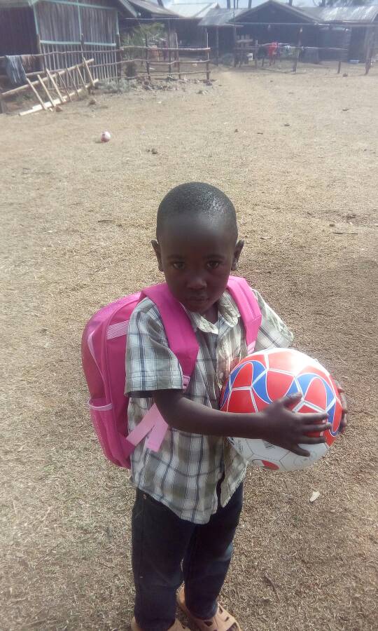 acf_org's tweet photo. Brian could not keep his hands off the footballs we recently sent to Kenya! Thank you for supporting us and sending happiness :) https://t.co/e5QM08rHqo