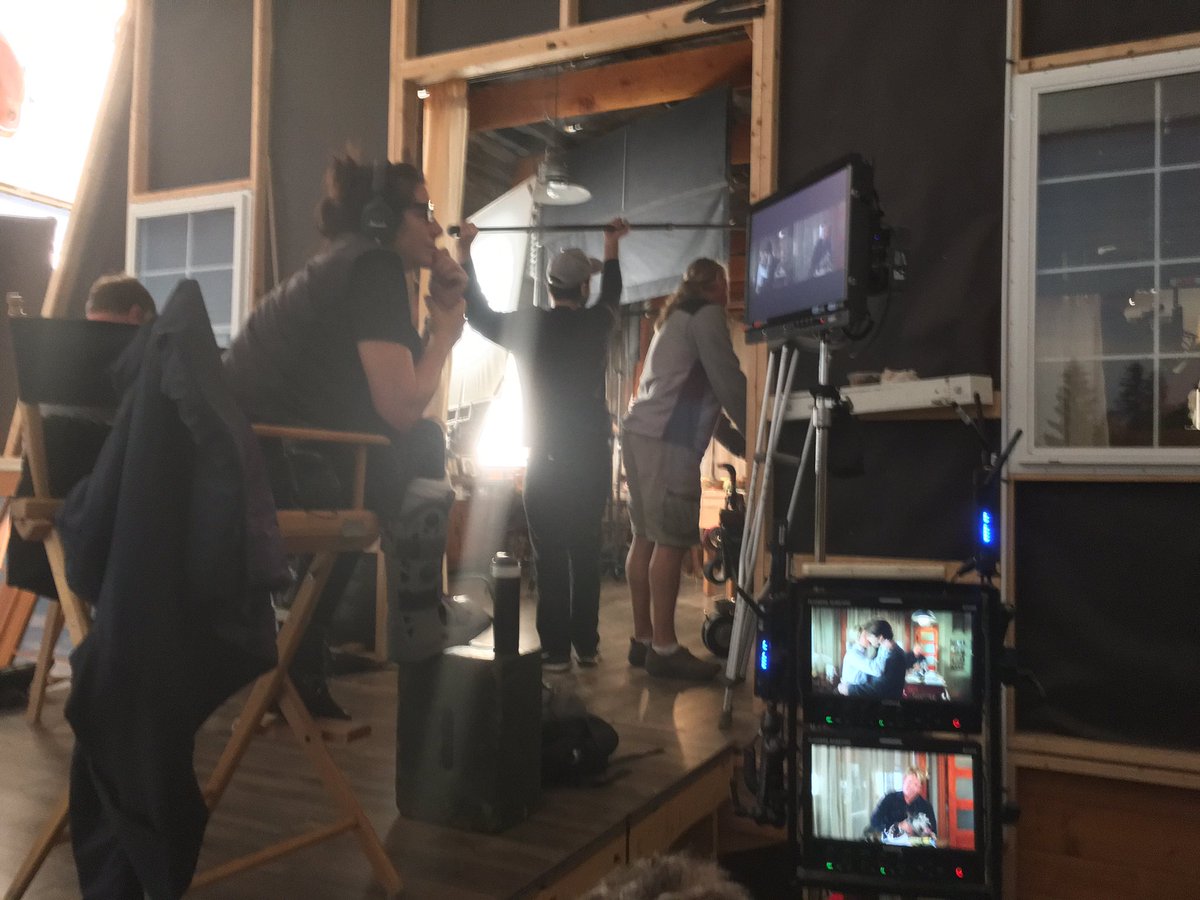 HeartlandOnCBC's tweet photo. Here's Rachel watching the larger screen as 2 cameras are rolling. One on Amy &amp; Ty kissing; the other on Tim holding Jasper. 🐕🎬❤️
#HLinProd https://t.co/lpKkMvclfW