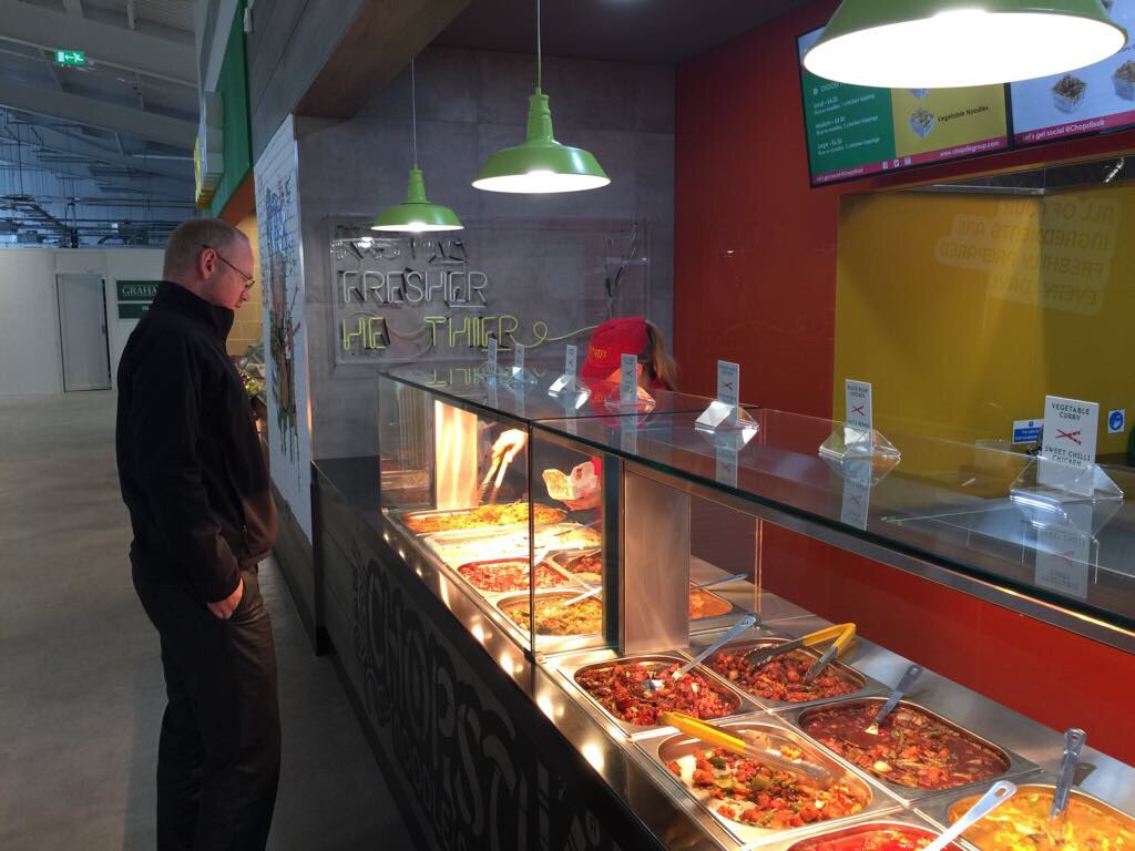 MoorefieldCo's tweet photo. Decisions...decisions! @djsdavidshaw from @WoodgateAir checks out the @ChopstixUK menu at our new food outlet @BelfastAirport https://t.co/V64w8ilZdp