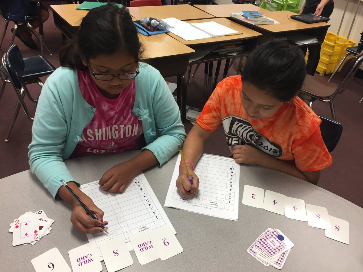 Playing comparing numbers. Simple game, but the students love it! <a href="/APSVirginia/">Arlington Public Schools</a>