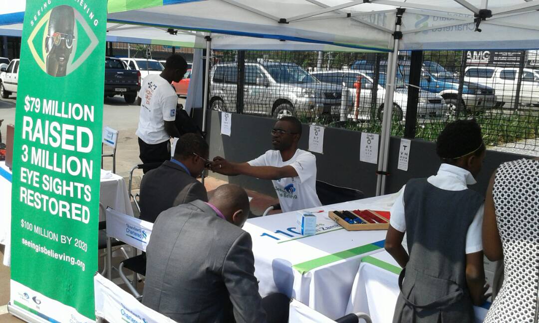 Sightsavers's tweet photo. It's #WorldSightDay! Celebrations happening around the world, including #Zambia where  @StanChart are holding eye screenings to mark the day https://t.co/OMFYhQOe9J