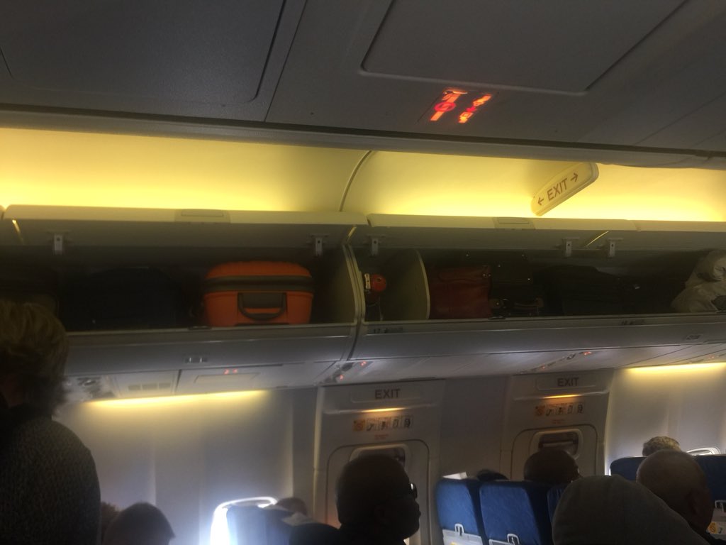 JayeshDaya's tweet photo. SAA flights - carry on luggage. Why are people allowed to carry more than 1 piece of luggage onto a flight. Now people are fighting/arguing. https://t.co/A5GZ5L0Al8