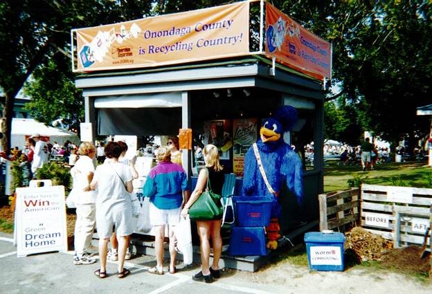 NYSDEC's tweet photo. #OCRRA and the Recycling Road Runner share recycling info with 1998 NYS Fair attendees. #CelebrateRecycling #TBT https://t.co/uXanPfy4jO