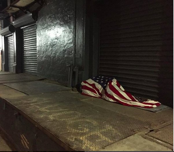 Homeless man sleeping wrapped in the flag. Excruciating photo by my partner while on a night dogwalk in Tribeca. Make This Viral #America