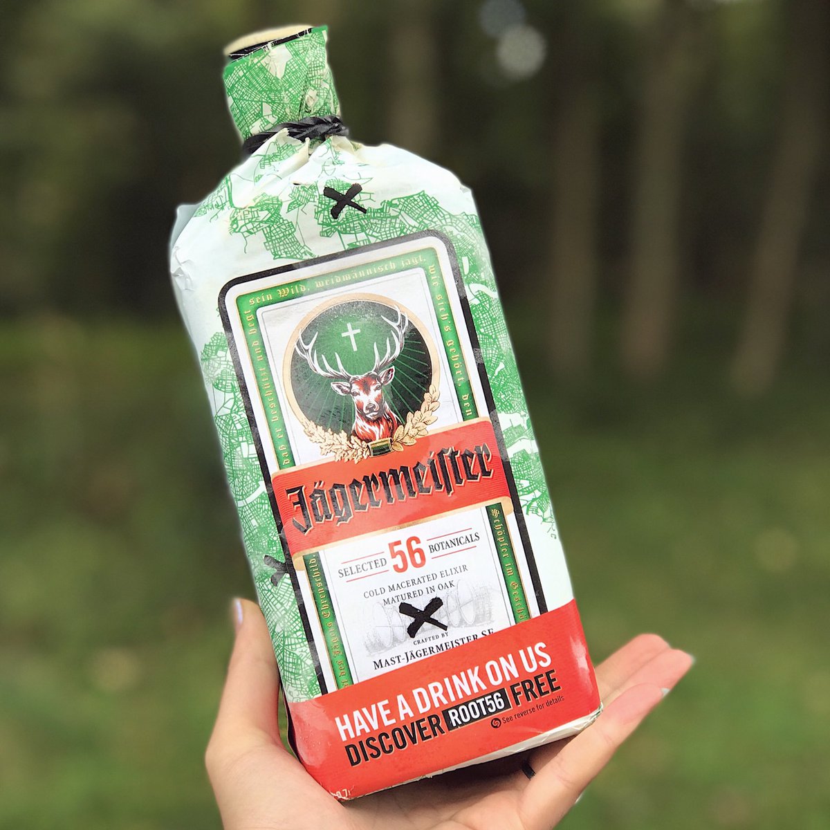 luisachristie's tweet photo. Casual pic in the woods w/ a @JagerUK #ROOT56 bottle + unicorn onesie 🦄 these bottle have a free cocktail code too 🦌https://t.co/29JhJAzaVL https://t.co/6Ezg1n0Uye