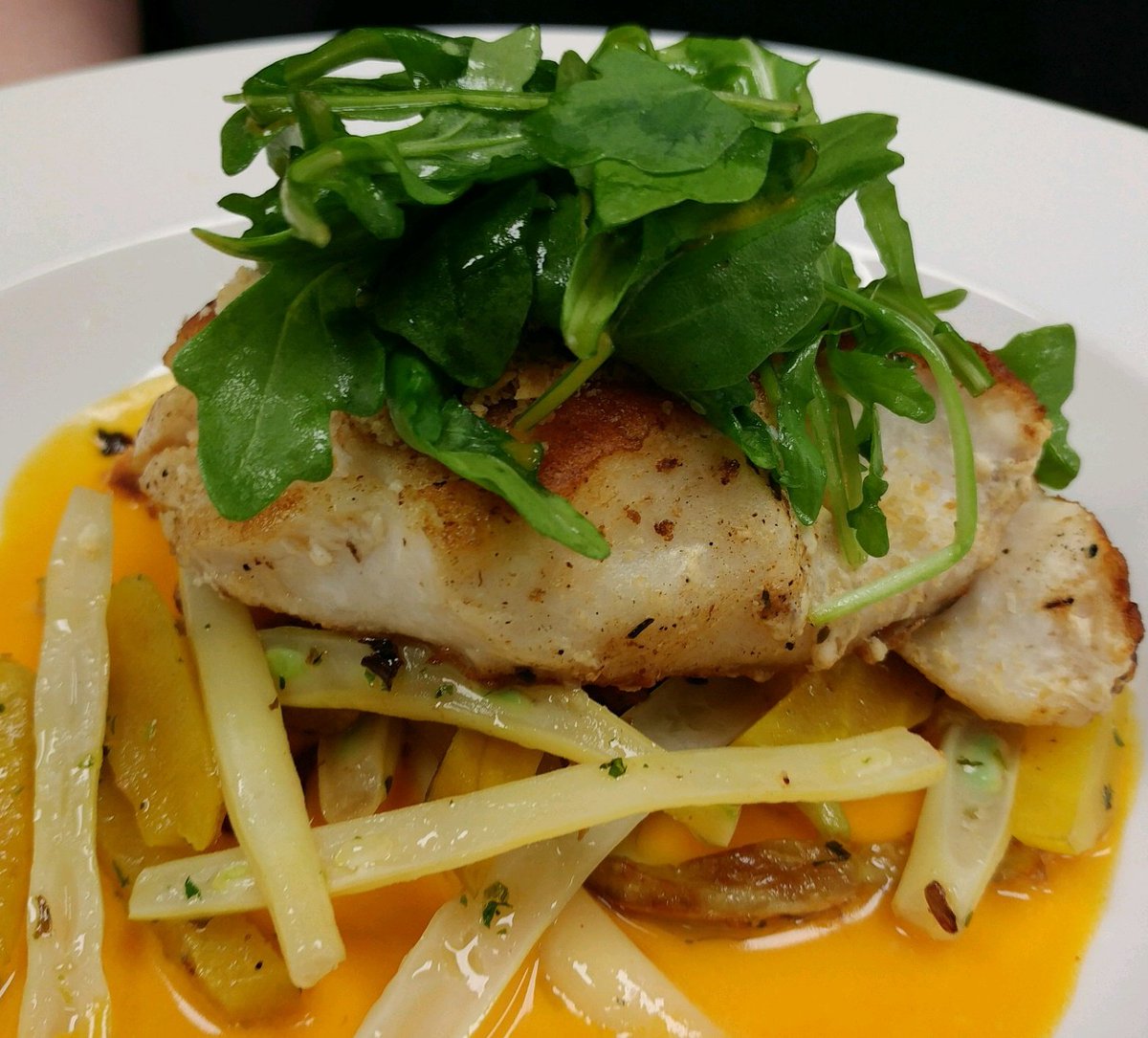 Ritz encrusted local tilefish w/ pork belly vegetable hash, and a smoked carrot beurre blanc