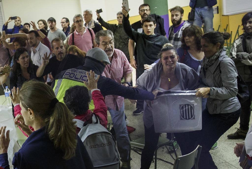 tea_monster's tweet photo. This is the state of Spanish democracy!! Police attacking regular folk defending their polling stations. Are we 1936?  #Ref1oct #CatalanReferendum #Votarem https://t.co/C0rJ6oMCce
