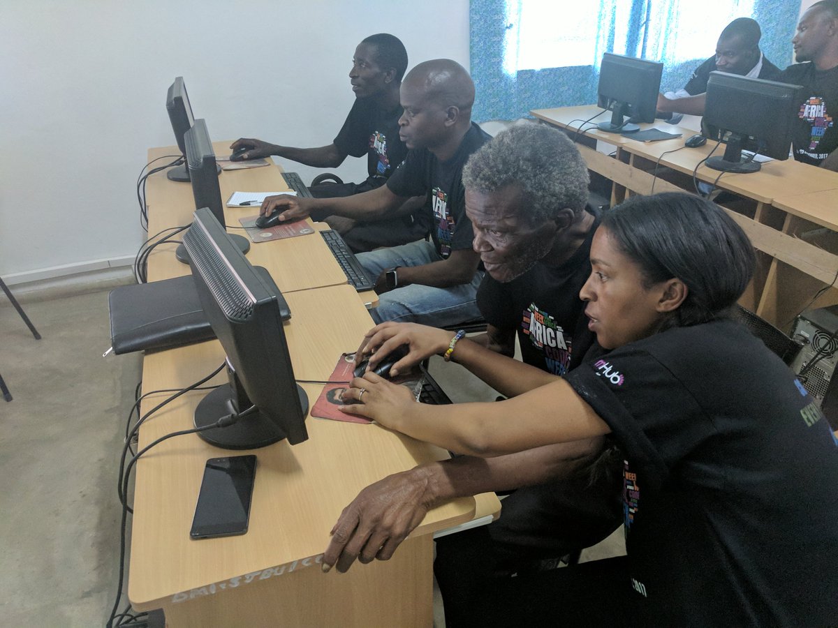 mHubMW's tweet photo. It is not too old to learn to code! Theresa Felino from @ScienceCentreCT helps one of the teachers #AfricaCodeWeek2017 https://t.co/MnwodTpPHO
