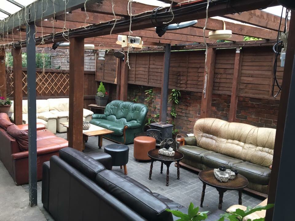 BlackCountryPub's tweet photo. Possibly the comfiest pub smoking area ever? Curl up around the log burner @TheLonglands Stourbridge. #pubs 
(Pic: Longlands FB) https://t.co/PCtHmJCbEP