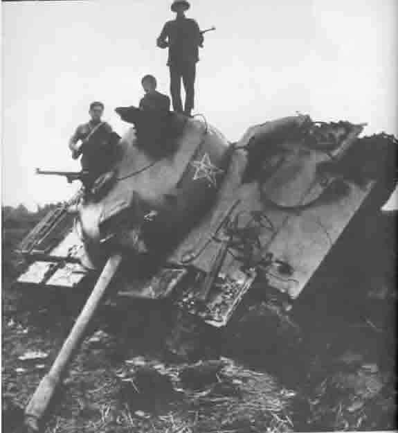 1979 - Vietnamese soldiers on a destroyed Chinese 8th Army tank
