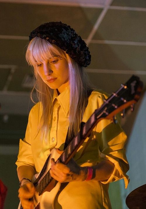 hayley playing the guitar through the years