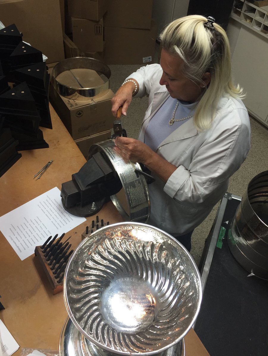 keeperofthecup's tweet photo. Engraving the #stanleycup. Not much has changed in the last century.  Same trophy, same tools, new names. @NHL @penguins  @HockeyHallFame https://t.co/JGifOPhkWH