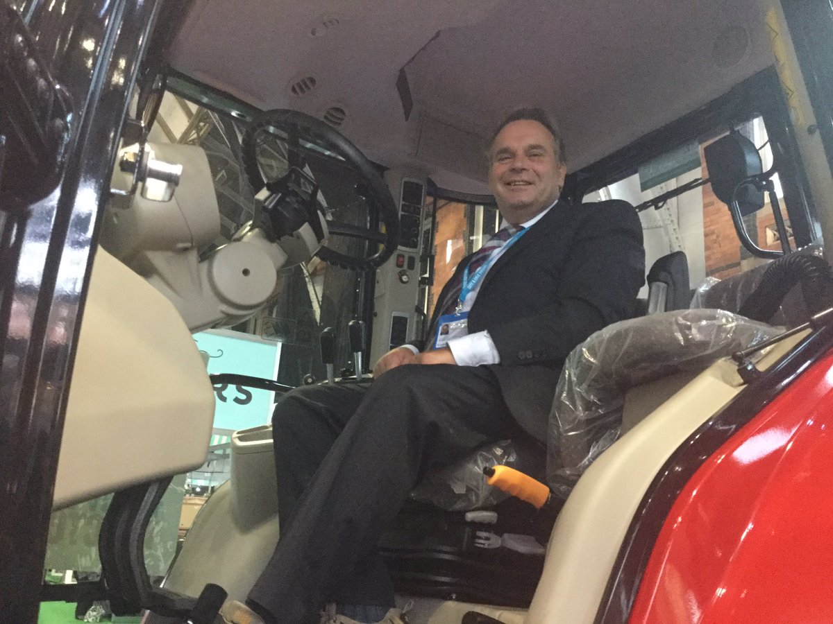 ClarissaELSlade's tweet photo. @neil_parish in the red tractor #cpc2017 https://t.co/X0dIMoAEFm