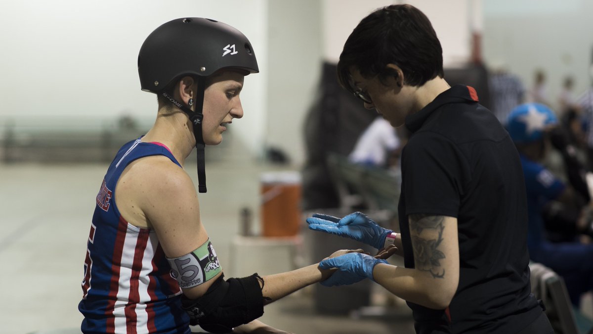 SportSideMed's tweet photo. Alex checking on a potential wrist injury during a Roller Derby event! #SportSideMedical https://t.co/KP0caMEUCJ