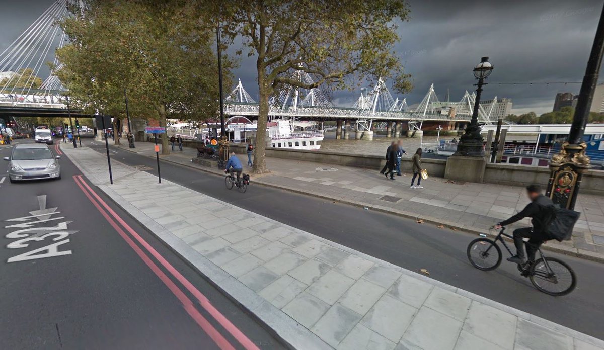 Recently built two way protected bike lane in London. This is what a permanent #BetterNaito could look like.