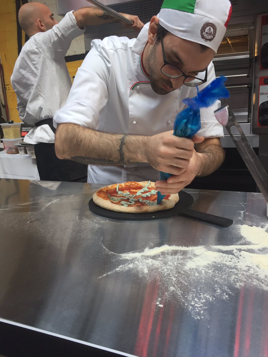 DineOutMagazine's tweet photo. Alessio Alcini from @FountainandInk topping his Technical Pizza #NationalPizzaAwards 🍕 https://t.co/NmFniwj9Jz