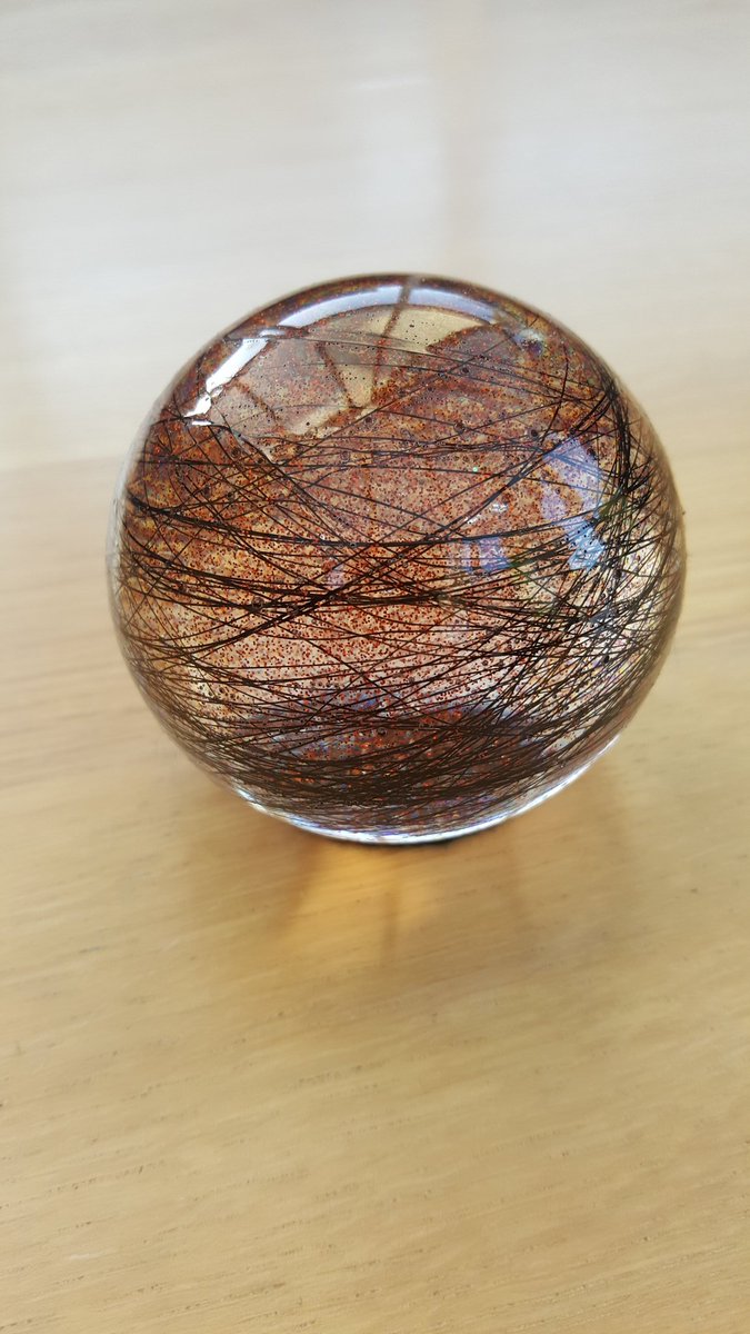 KeepsakeHair's tweet photo. Beautiful paperweight weight done with horse hair and Amber glitter, x mas orders filling up quick #horses#horsehair #jewellery#paperweight https://t.co/1M4UcomInk