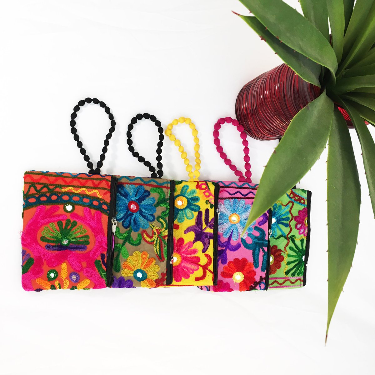 FiestaSA's tweet photo. Embroidered wristlets at the #FiestaStore, the perfect size for your phone, only $13.99. Grab yours today at the Fiesta Store! #FiestaStyle https://t.co/N6B5wXwPWd