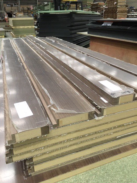 Hardwood rebated Studio cubicles in the factory <a href="/FormicaGroupEU/">Formica Group Europe</a> F5150 American Walnut. To be installed in a high end car showroom