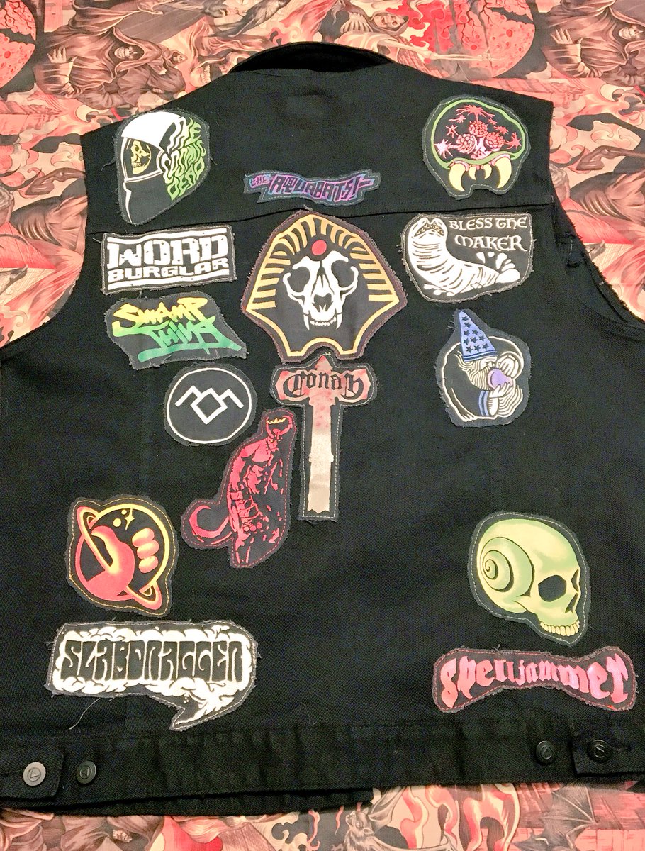 GarbageBarf's tweet photo. Current state of the #battlevest patches hand made and painted #cosmicdead #gravesatsea #twinpeaks #hellboy #spelljammer #slabdragger #conan https://t.co/l2xDWS34Sg
