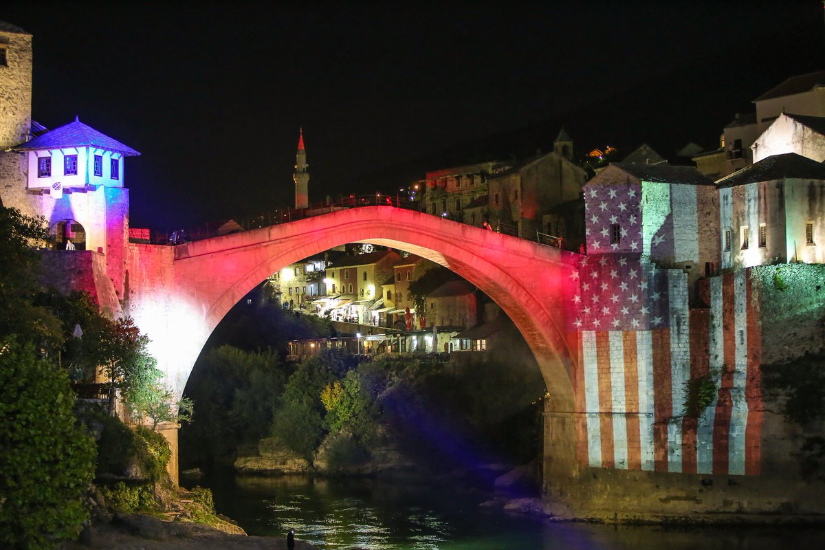 The Old Bridge in Mostar, Bosnia-Herzegovina draped in the red, white, and ...