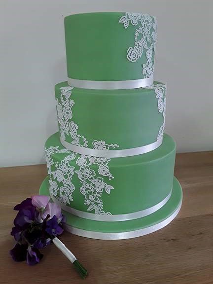 Sage green #weddingcake - Classic vanilla, tangy lemon &amp; rich chocolate sponges with delicate ivory #cakelace flowers added at venue.