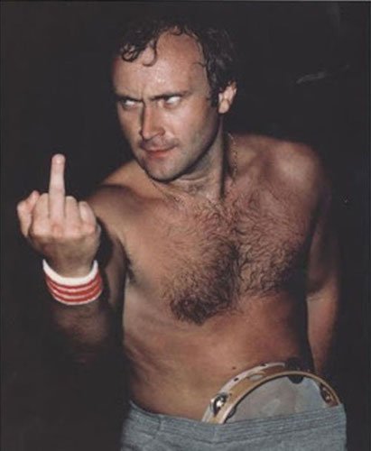Phil Collins...clearly in a good mood and with a tambourine in his pants.