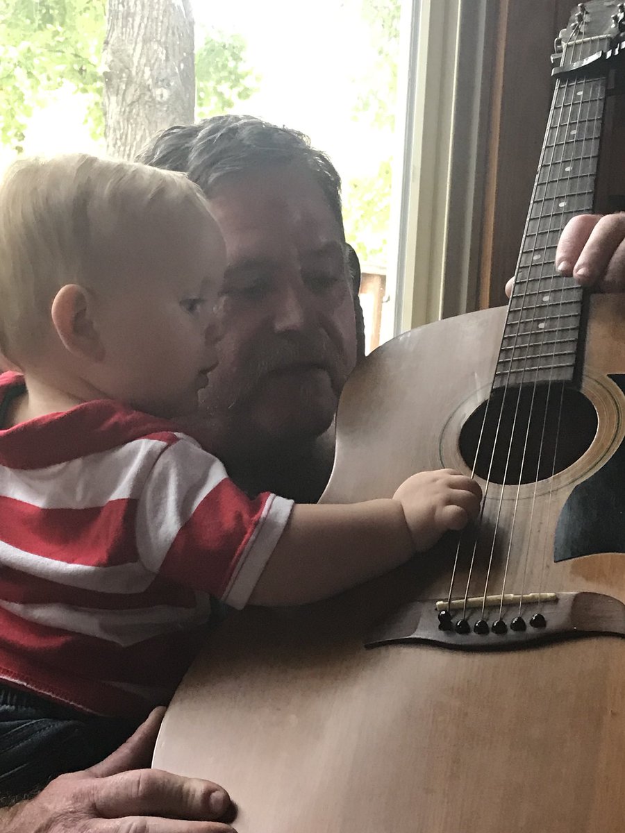 Papa sharing his love of music with his grandson #pricelessmoment #grandparentlove #startthemyoung #futureguitarplayer