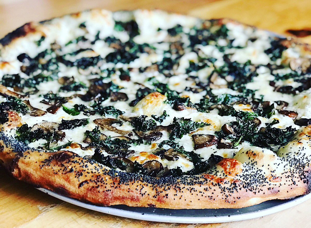This week’s pizza special! Crispy fried kale, sautéed mushrooms, Tallegio, Béchamel, Mozzarella &amp; Parmesan. 🍕 🍄 🧀