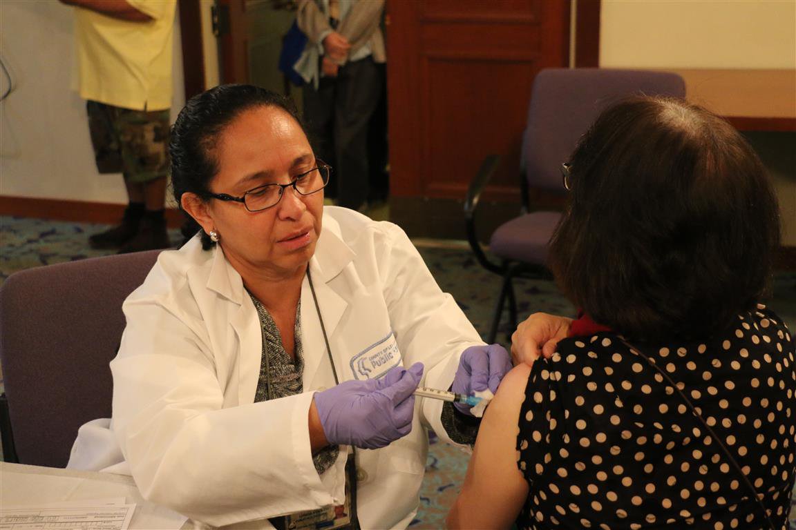 person receiving flu shot