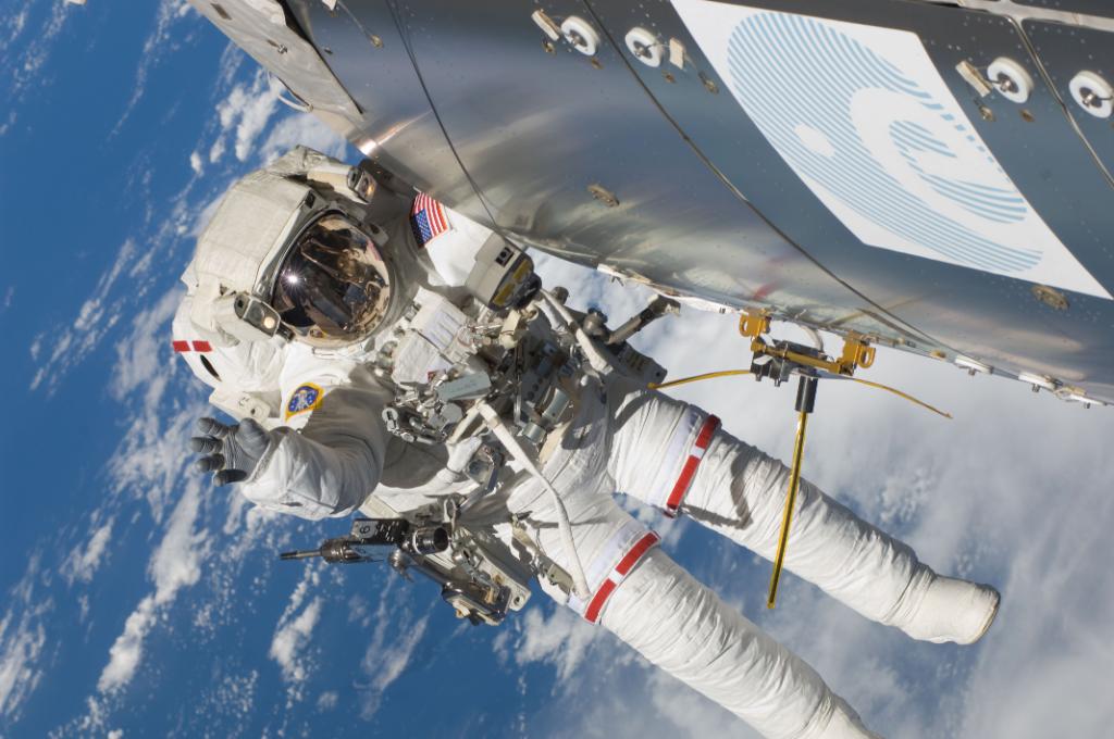 NASA's tweet photo. LIVE NOW: Watch @AstroKomrade &amp; @Astro_Sabot prepare to go outside @Space_Station for today’s #spacewalk https://t.co/mzKW5uV4hS Q? #askNASA https://t.co/hOAQQDG5tP