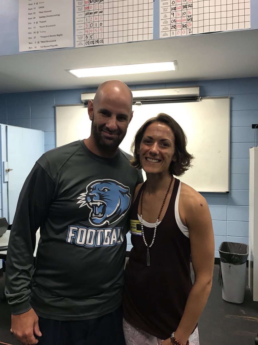 DatesmanDebra's tweet photo. SBHS Cougar football squad practicing yoga with instructor Christina Joy of Be Unlimited Yoga. #cougarpride https://t.co/6X2M53LWV9