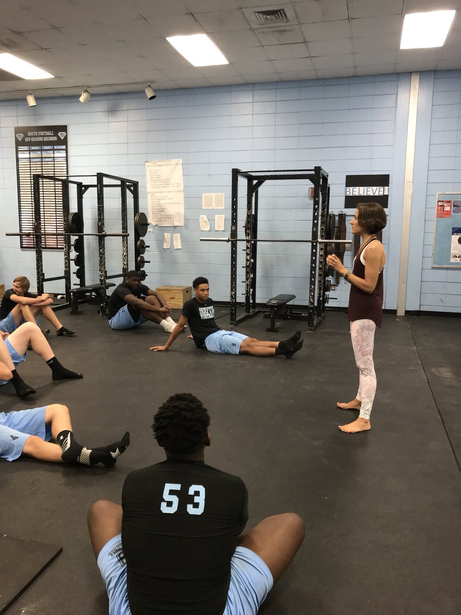 DatesmanDebra's tweet photo. SBHS Cougar football squad practicing yoga with instructor Christina Joy of Be Unlimited Yoga. #cougarpride https://t.co/6X2M53LWV9