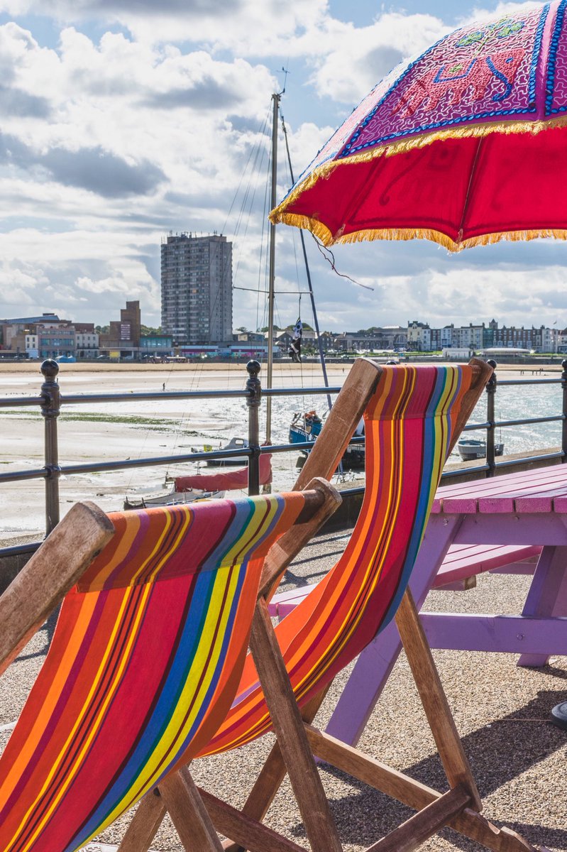 seaside_days's tweet photo. Colourful #deckchairs on #margate harbour arm with the #iconic #arlingtonhouse in the background #Thanet #lovemargate https://t.co/cE6w8fZbpG