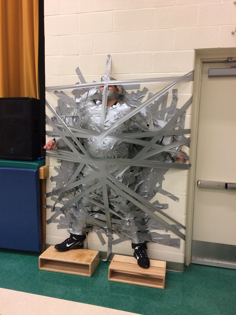 MsTsMusic's tweet photo. #KindreePS celebrates, raised $3900 for #cancer research.  Gym teachers duct tapped to the wall by students!  @PeelSchools @KindreeCoyote https://t.co/YNkglIOEL9