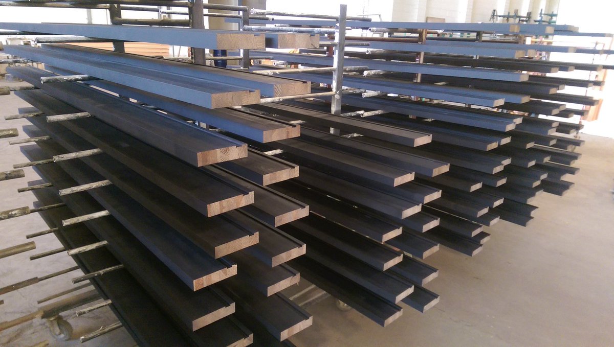 Redwood door frame materials. Black primer applied ready for on-site finishing. #timber #priming #firedoor