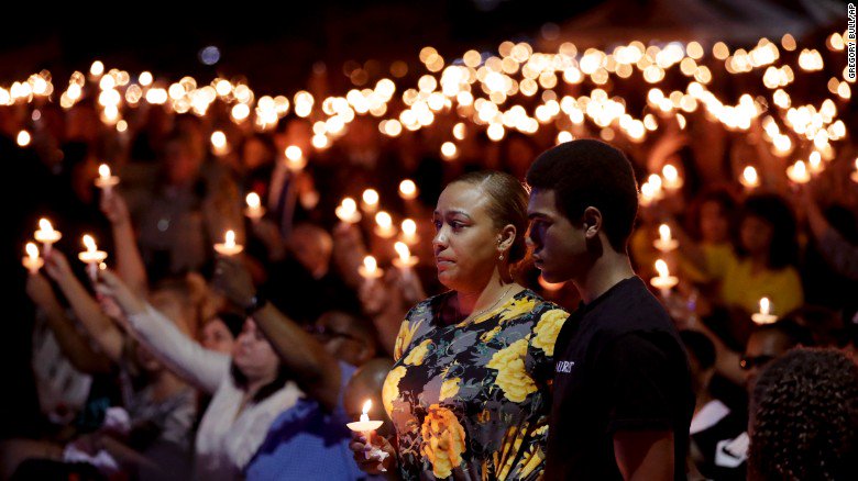 CNN's tweet photo. Thousands gather at a vigil for Charleston Hartfield, an off-duty police officer killed in the Las Vegas shooting https://t.co/5La5SeM1jo https://t.co/QiE7UICiFH