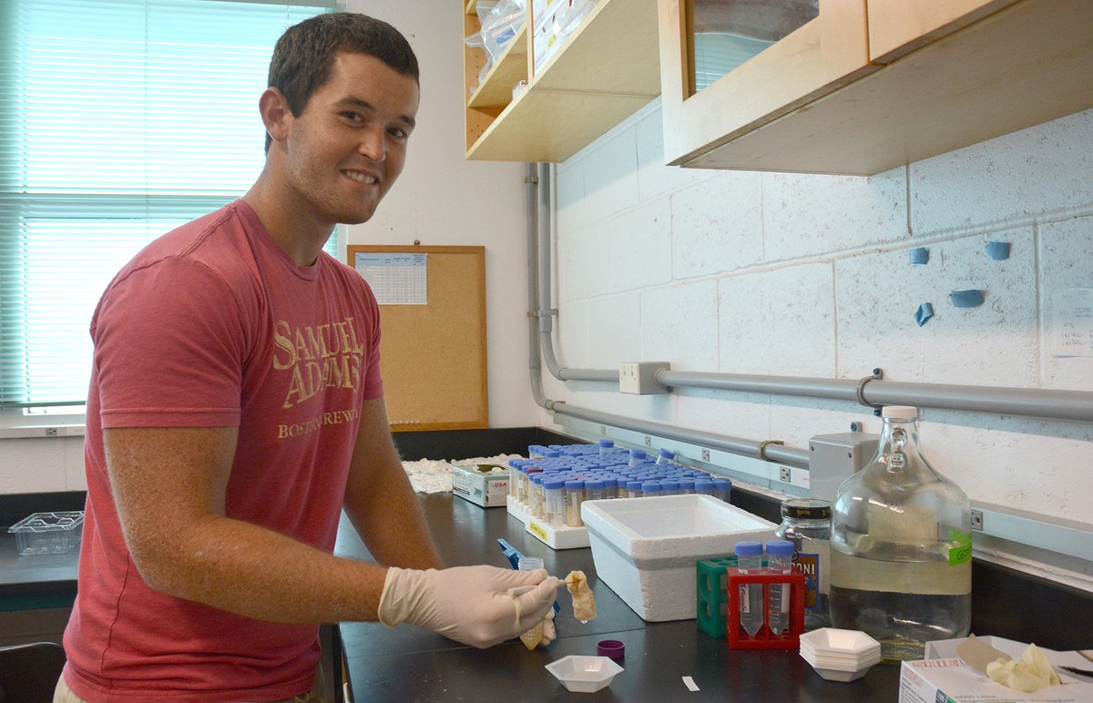 BIOSstation's tweet photo. Alex Lundberg, a 2017 @NSF REU intern at BIOS, weighs #lionfish eggs in the lab as part of his #biodiversity #research project. #NSFstories https://t.co/N8aA4EZZ3p