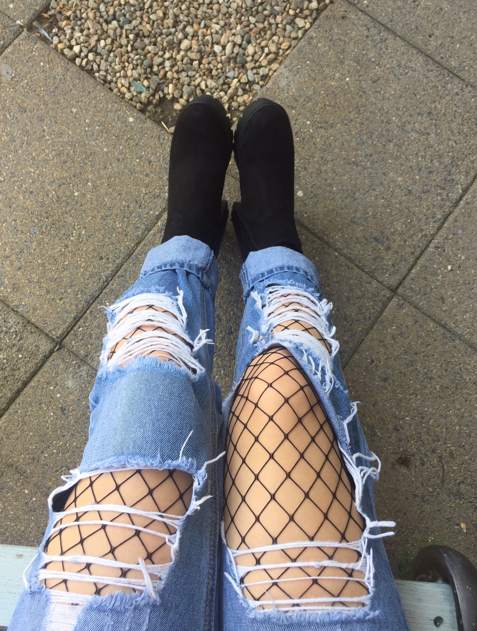 Fishnet stocking top with ripped jeans