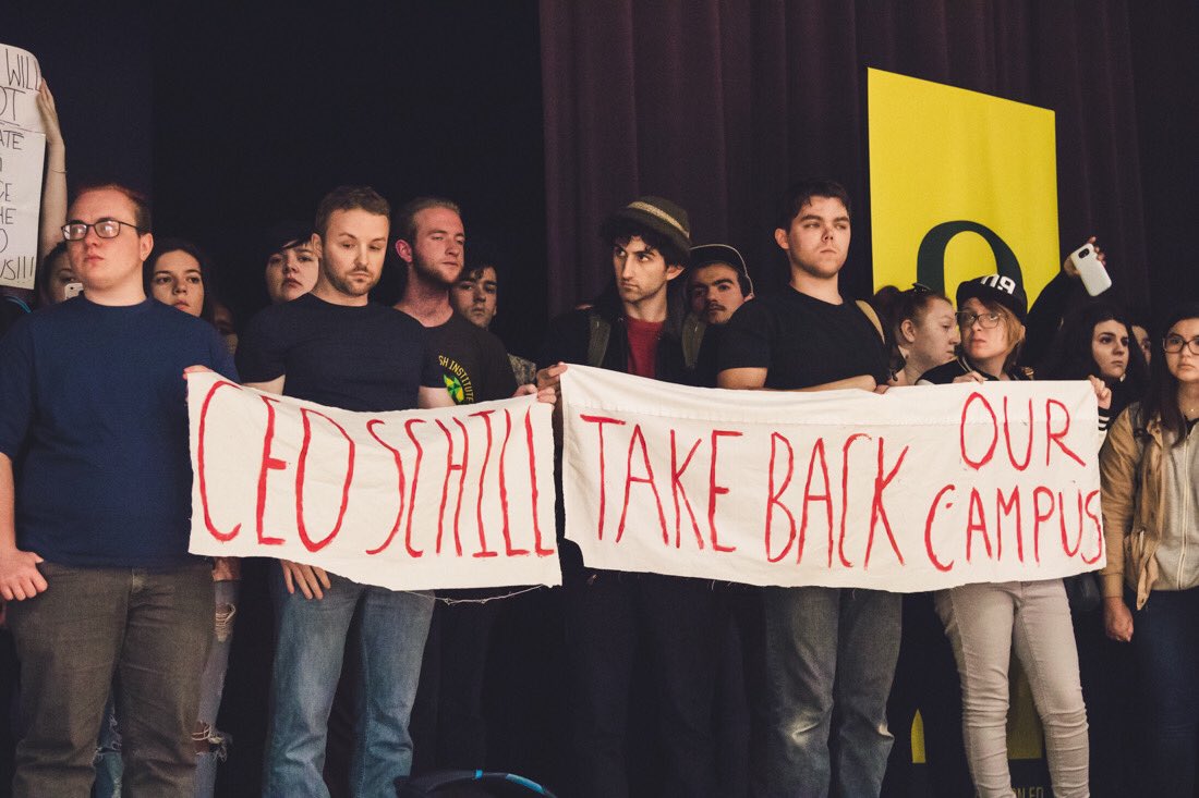 SARTAKESPICS's tweet photo. President Schill's State of the University address is suspended after U of O students rush the EMU Ballroom stage in protest. https://t.co/rU24TAMKog