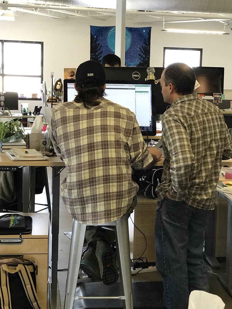 VictorOps's tweet photo. Who wore it better? #flanelfriday #desksofVO https://t.co/TQSc7Mo2Ys