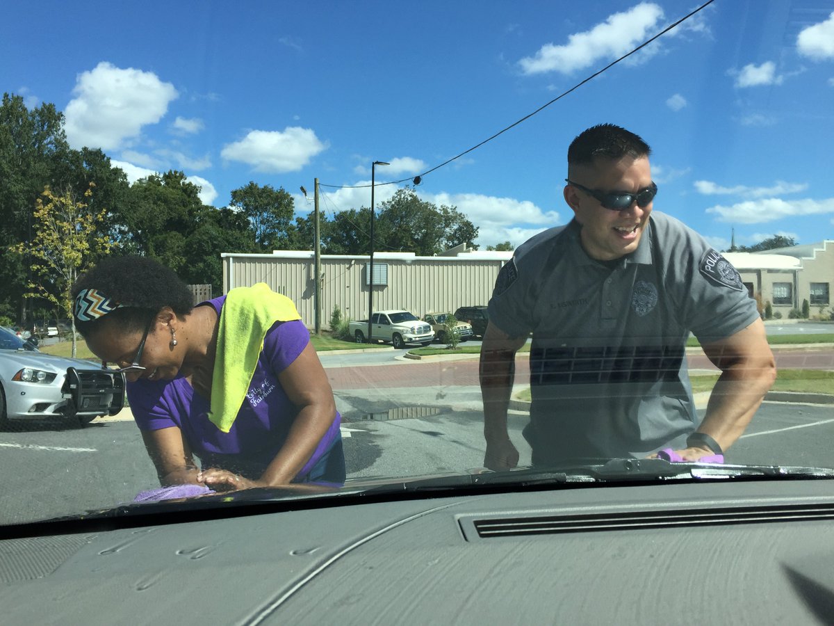 CityofFairburn's tweet photo. Fairburn's Finest hard at work servicing community vehicles earlier today. Did you stop by to get your free car wash? #CommunityPolicingWeek https://t.co/mPOKSTrwpy