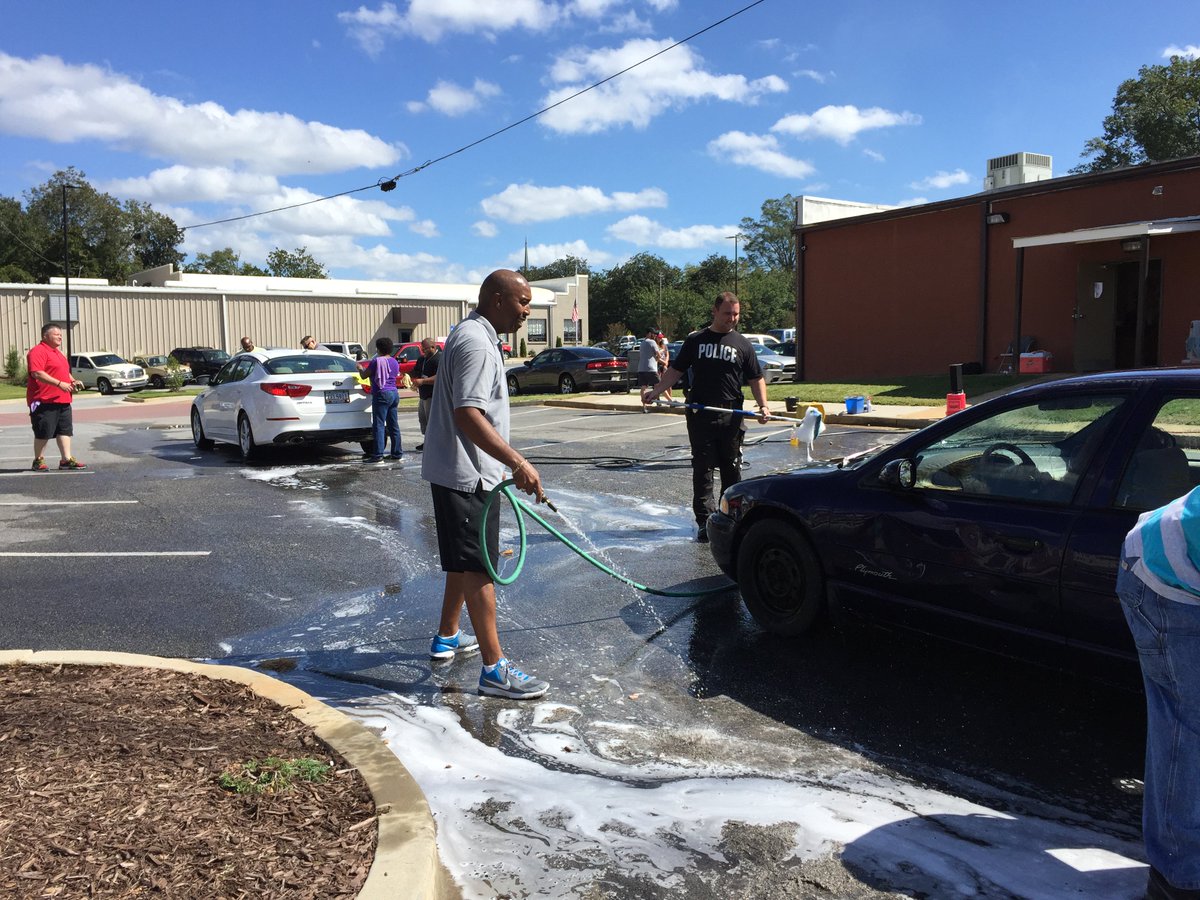 CityofFairburn's tweet photo. Fairburn's Finest hard at work servicing community vehicles earlier today. Did you stop by to get your free car wash? #CommunityPolicingWeek https://t.co/mPOKSTrwpy